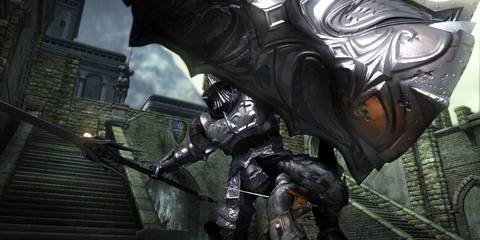 An armored character raising their shield in Demon Souls