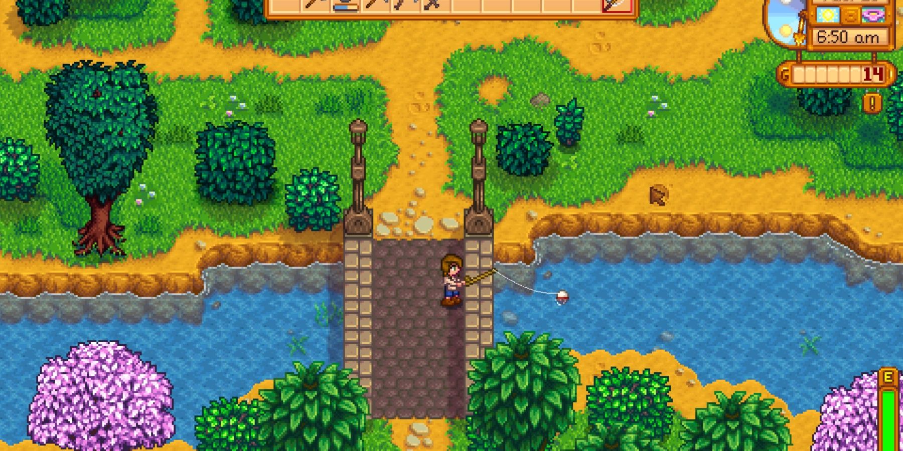 The player standing on the bridge towards the beach fishing in the river