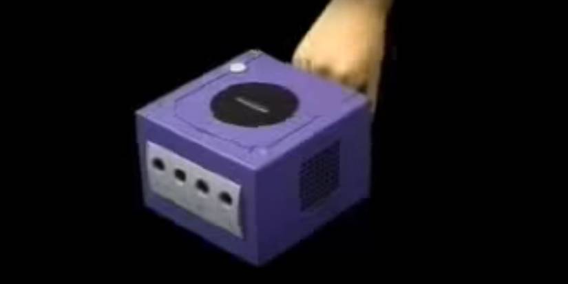 Person Grabbing GameCube Handle