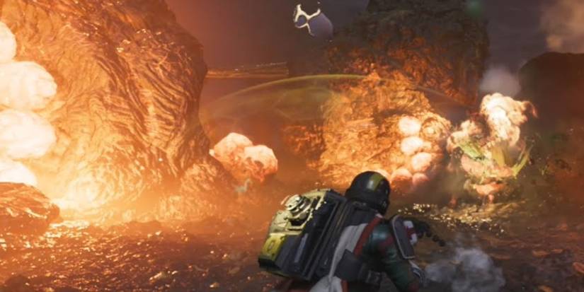 A helldiver stands in front of a Terminid hatchery