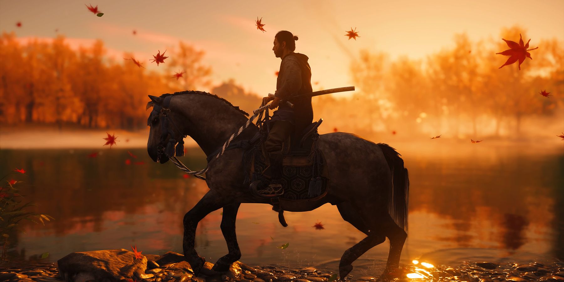 Jin Sakai riding his horse in the sunset in Ghost of Tsushima