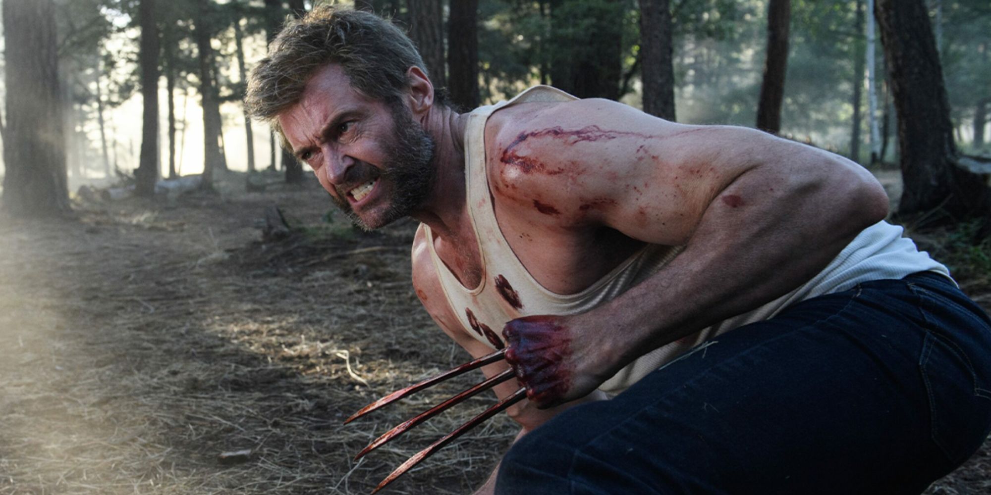 Logan fighting in a forest covered in blood