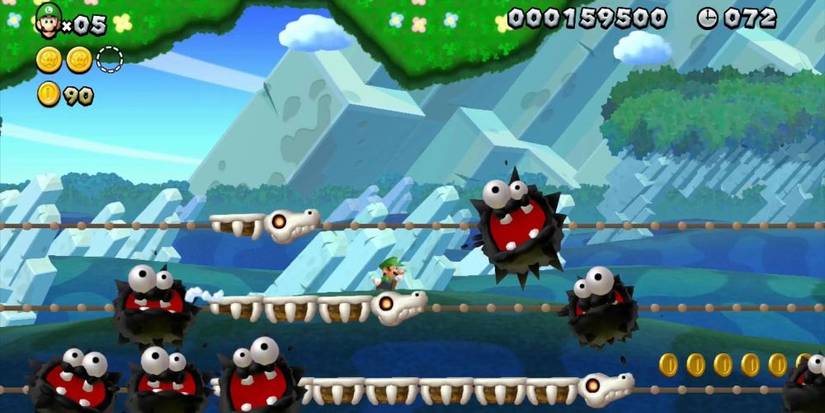 Luigi avoiding a bunch of Fuzzies in a particularly tough level of New Super Luigi U.