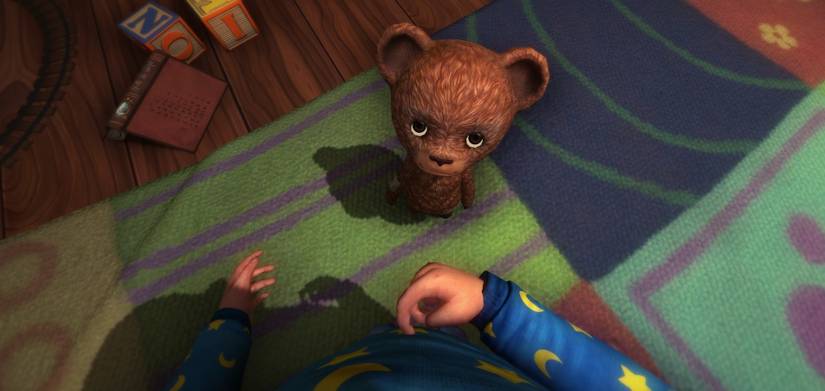 main character of Among The Sleep looking at a teddy bear