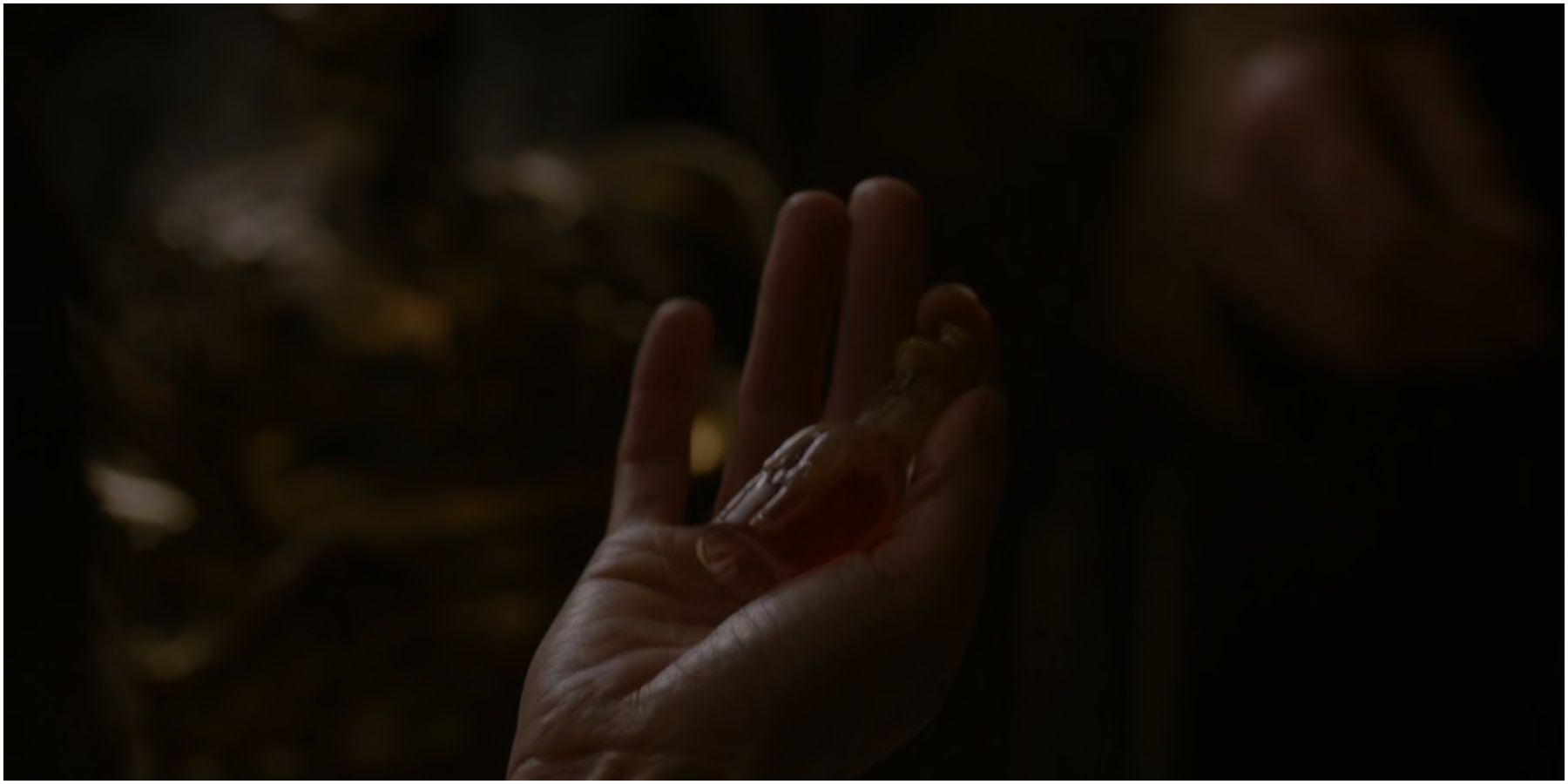 Cersei Lannister holds a vial of Essence of Nightshade in Game of Thrones.