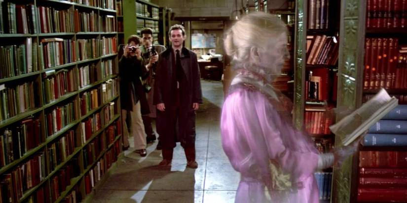ray, egon and peter looking at the librarian ghost