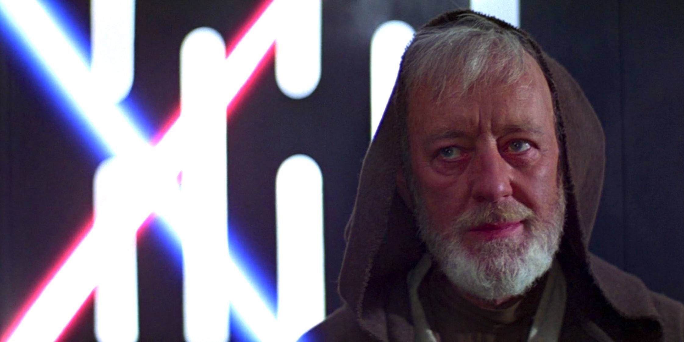Sir Alec Guinness as Obi-Wan Kenobi smiling just before his death in Star Wars: Episode IV: A New Hope