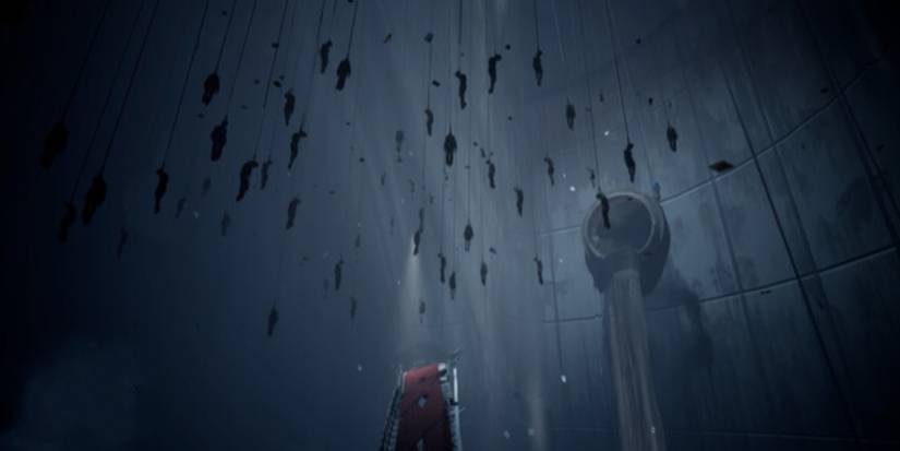 A shadowy image with many bodies hanging from the ceiling.