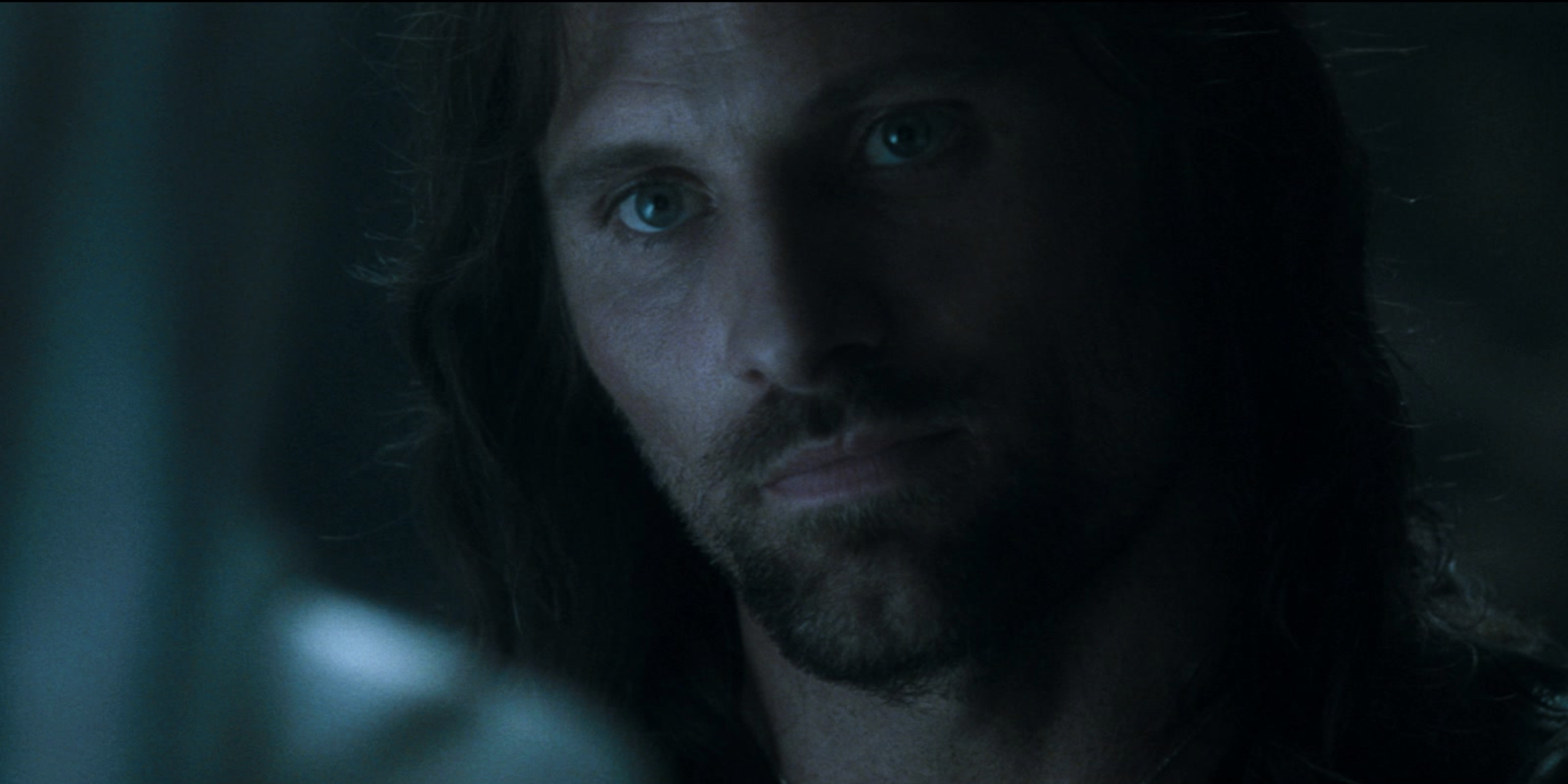 A close-up of Aragorn in dim light