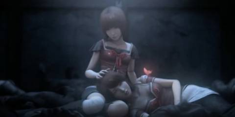Mayu with Mio's head on her lap in Fatal Frame 2: Crimson Butterfly 