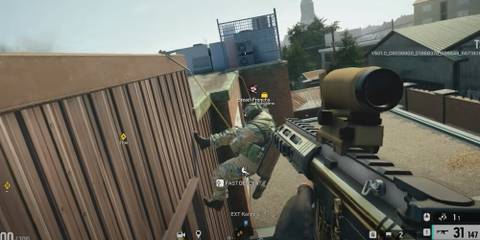 Player rappelling up a building in Rainbow Six Siege