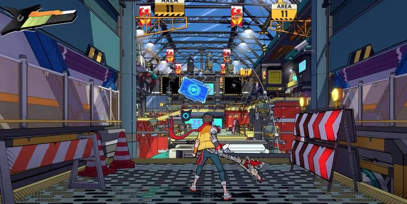 Chai standing in a large factory 