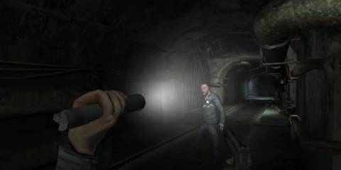 Player aiming a flashlight at a zombie 
