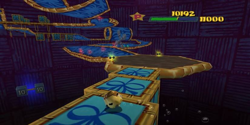 SpongeBob rolling around a large obstacle course 