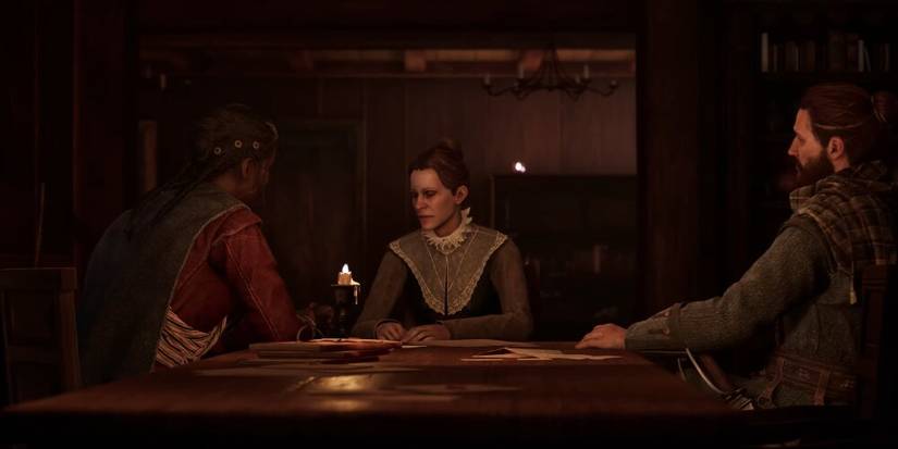 Red and Antea speaking to an woman at a table 