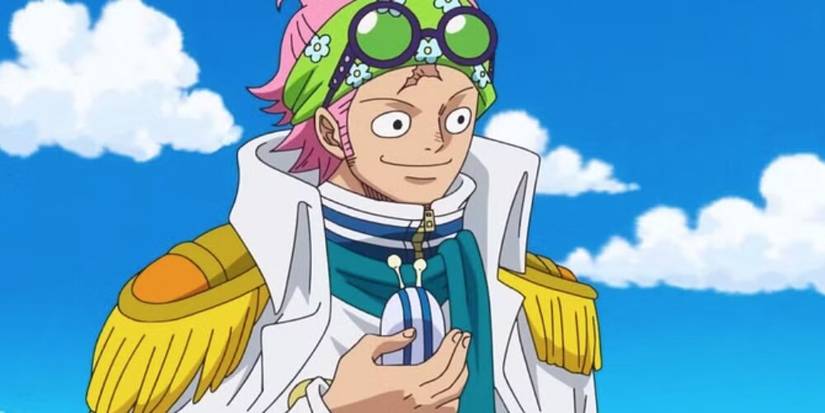 Coby holding a Den Den Mushi 