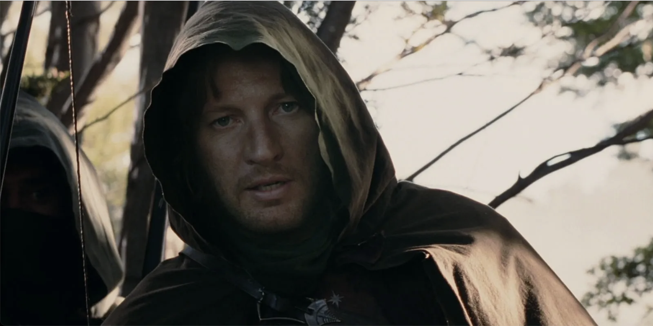 Faramir in a hood holding a bow