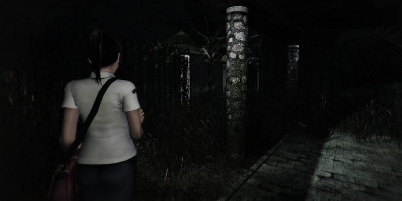 Snippet of the main character from DreadOut walking in a dark area with her phone's flashlight.