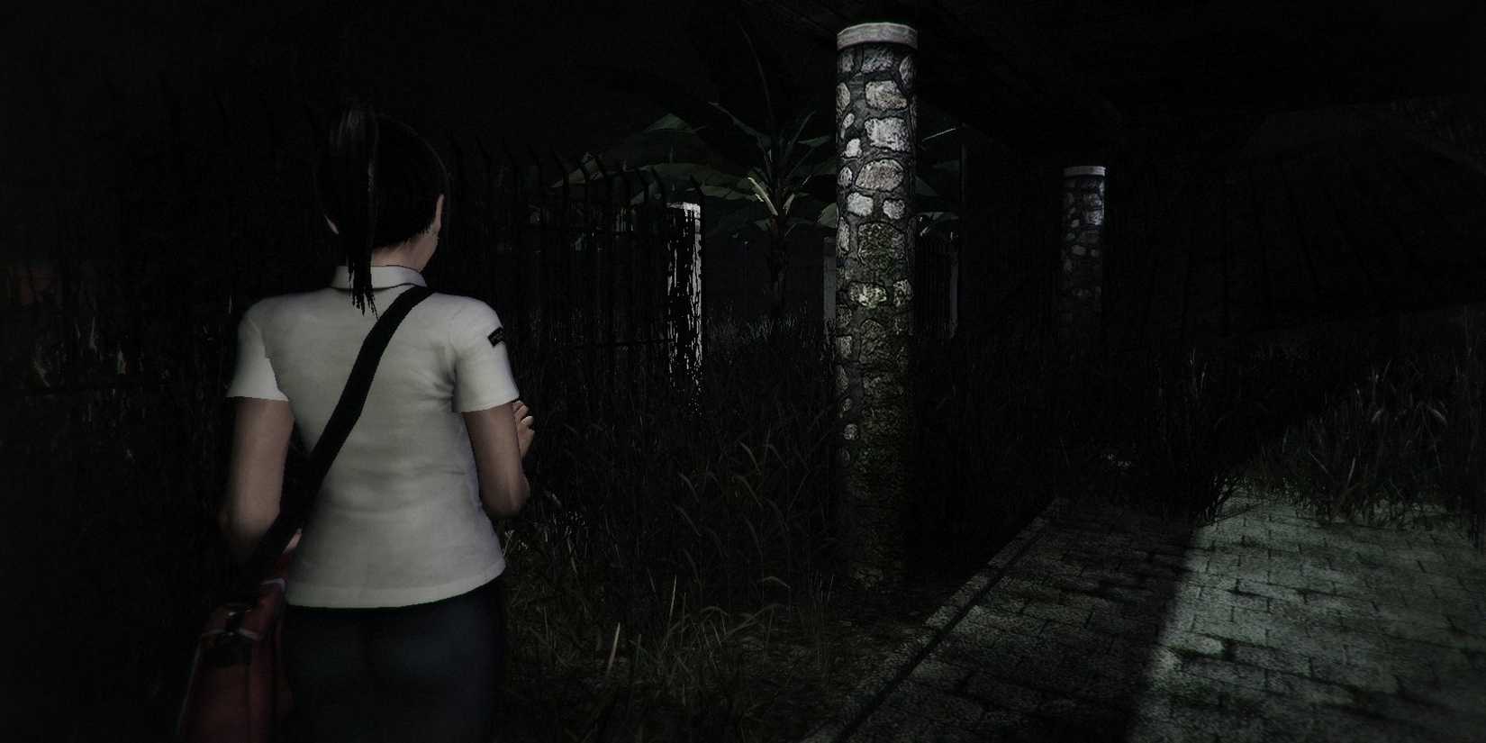 Snippet of the main character from DreadOut walking in a dark area with her phone's flashlight.