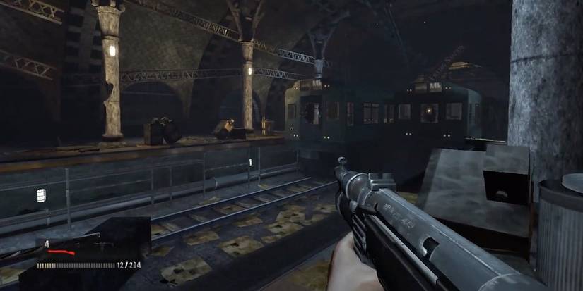 Holding a machine gun in an abandoned subway