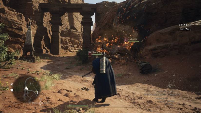 A player standing in front of a dead and burning Griffin in Dragon's Dogma 2