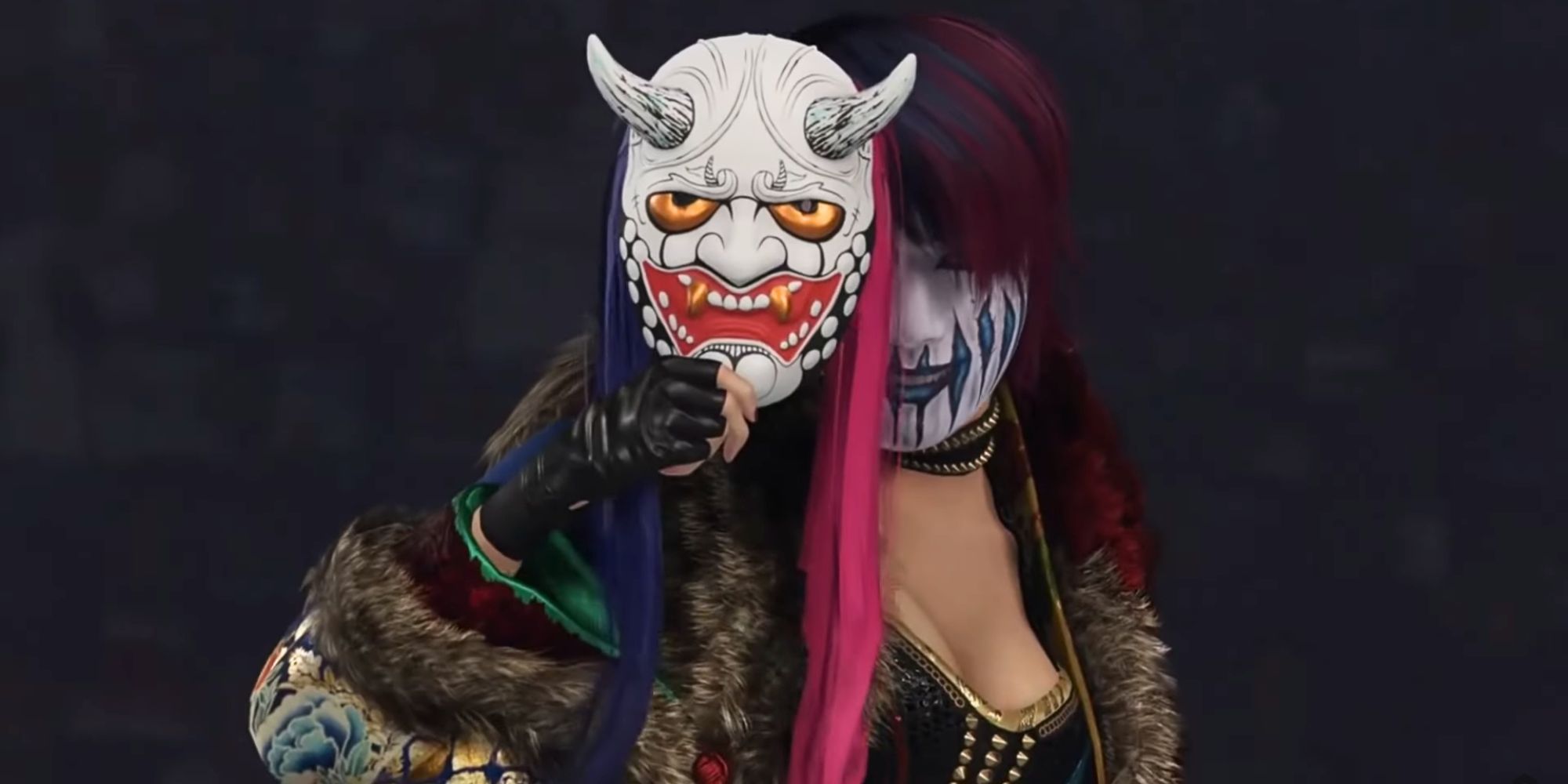 Asuka half covering her face with her mask in WWE 2K24