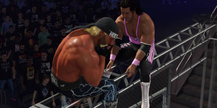 WWE 2K24 Bret and Hogan fighting on the cage