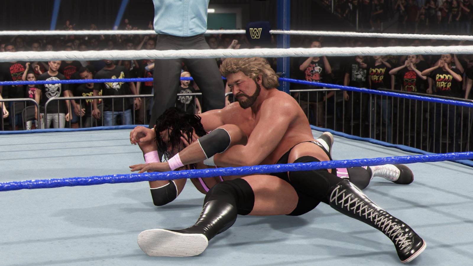 WWE 2K24 Bret Hart trapped in the Cobra Clutch from the Million Dollar Man
