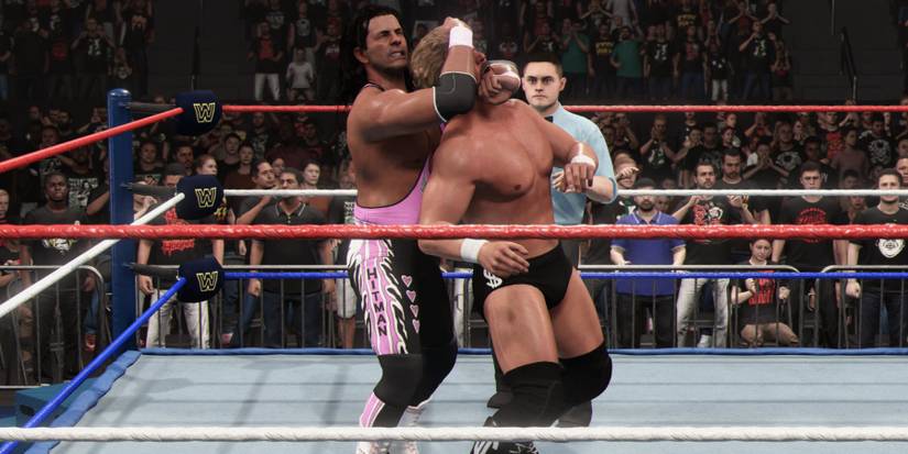 WWE 2K24 Bret Hart with the Sleeper Hold on the the Million Dollar Man