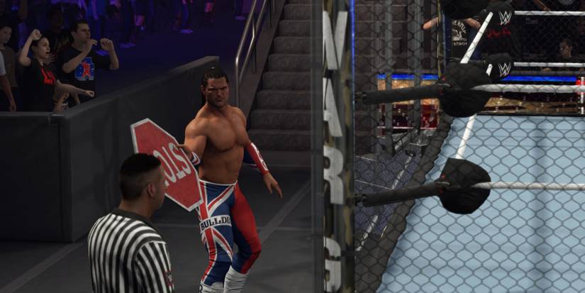 WWE 2K24 British Bulldog grabbing a weapon before entering the Wagames
