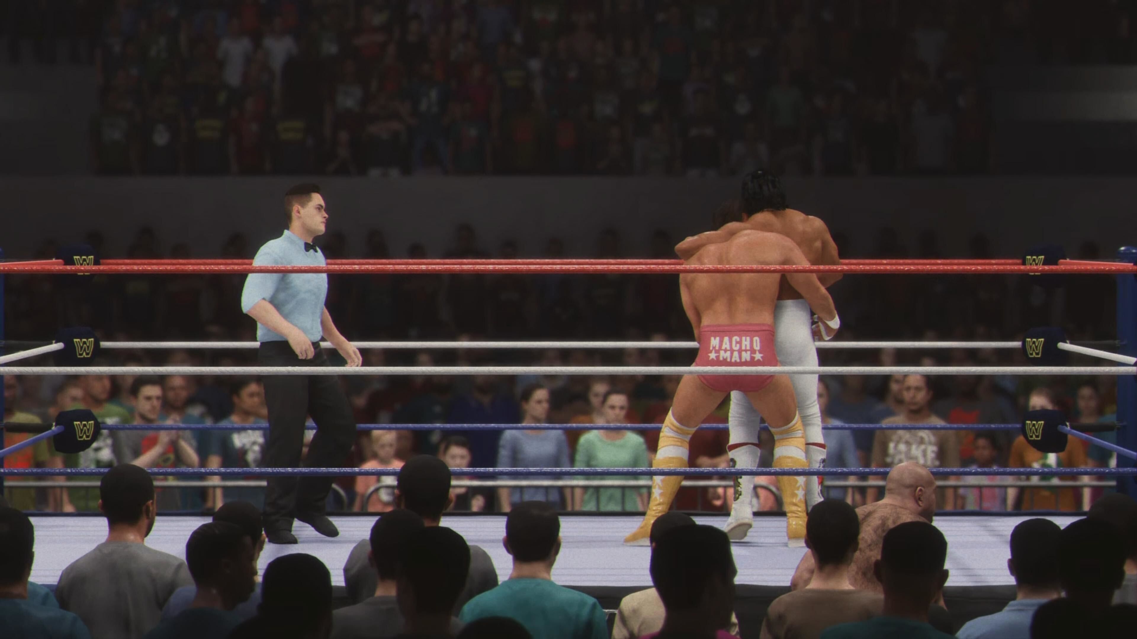 Randy Savage and Ricky Steamboat in a match in WWE 2K24