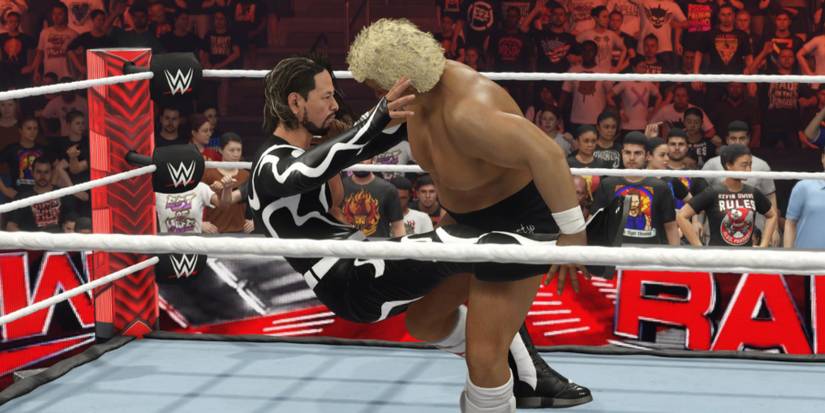 WWE 2K24 Dusty catching the leg and tripping intto the submission hold