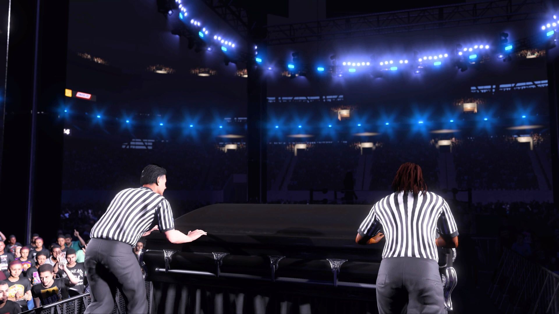 Two referees bringing in a casket in WWE 2K24 - How to Win a Casket Match in WWE 2K24