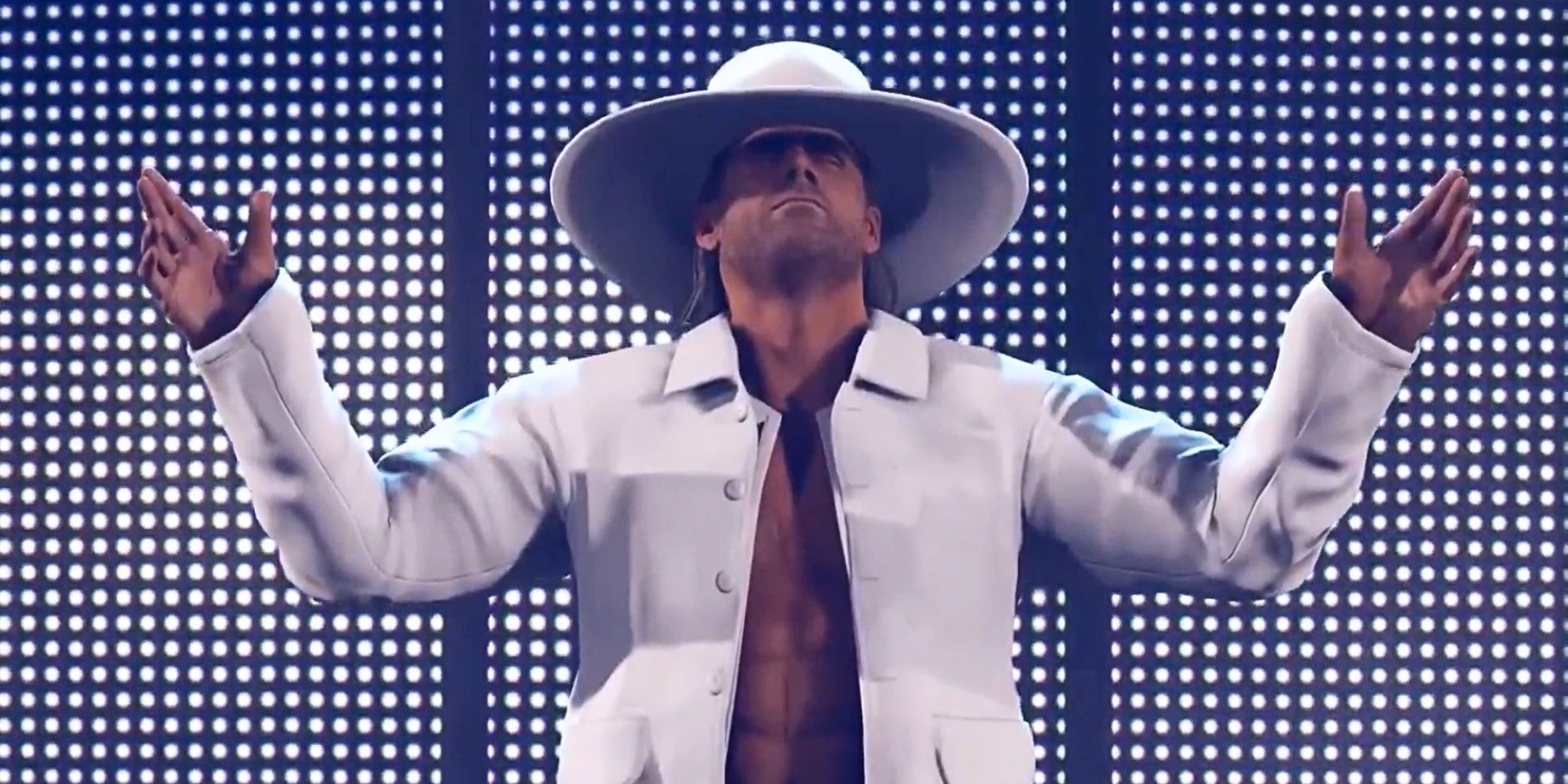 Shawn Michaels in a white hat and coat in WWE 2K24