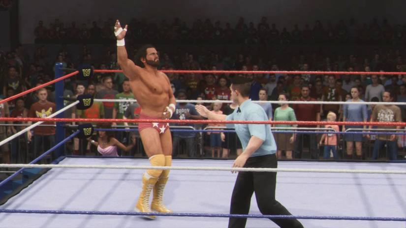 Macho Man Randy Savage raising a hand to the crowd in WWE 2K24