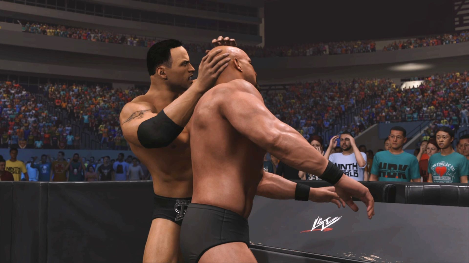 The Rock attempting to slam Steve Austin's head into a table in WWE 2K24