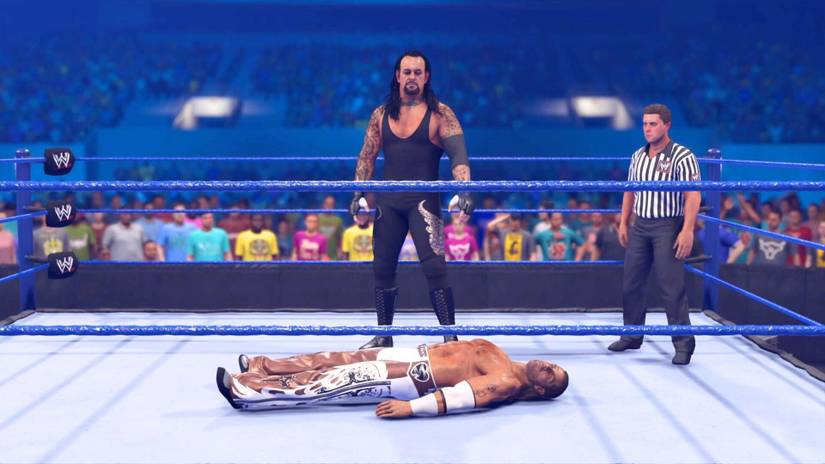 Undertaker standing over a grounded Shawn Michaels in WWE 2K24