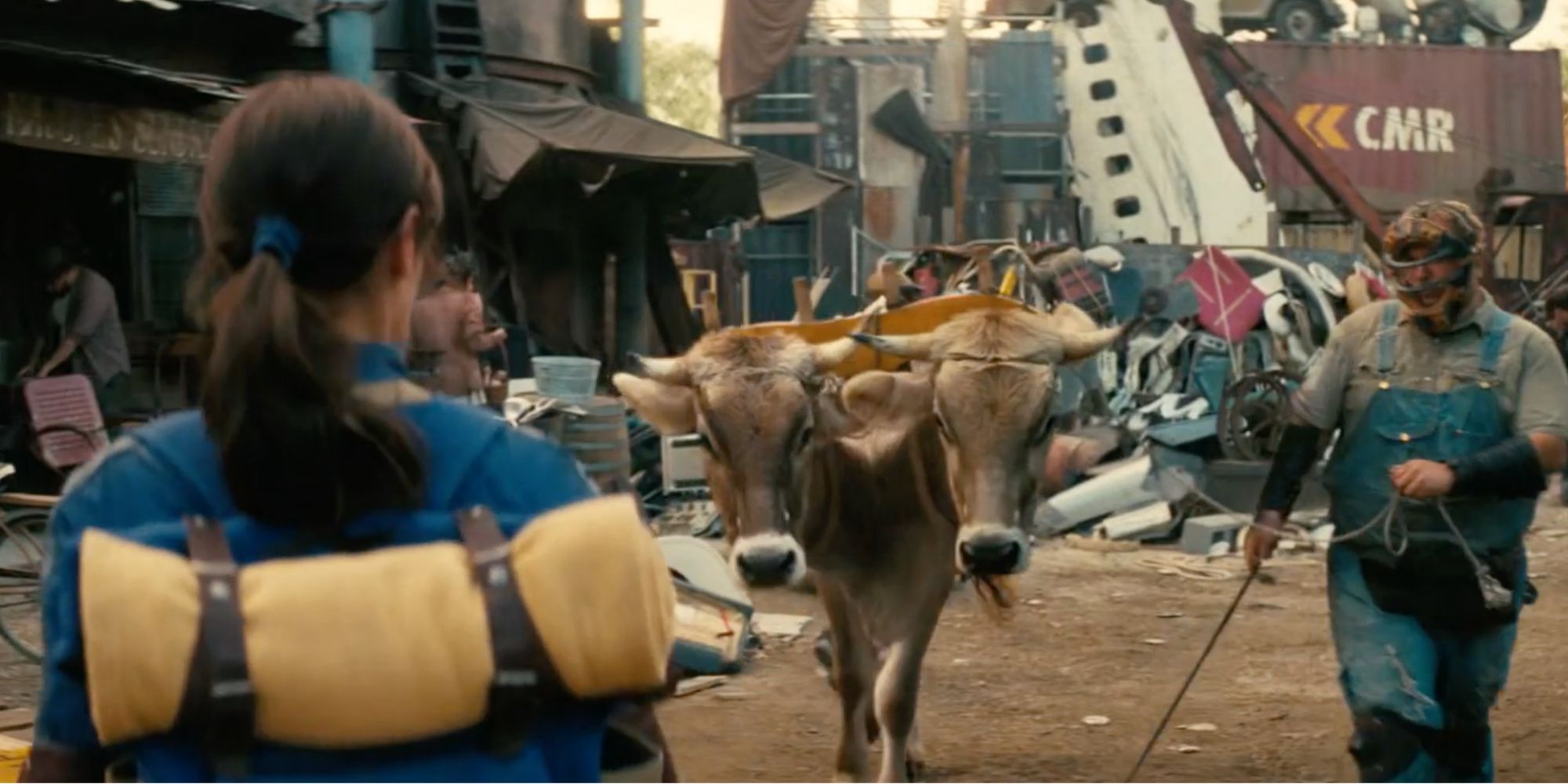 A Brahmin being led by its owner in Amazon’s Fallout Show