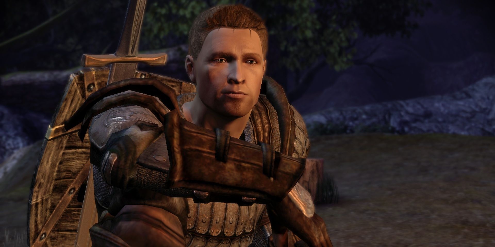 Alistair sitting down in Dragon Age: Origins