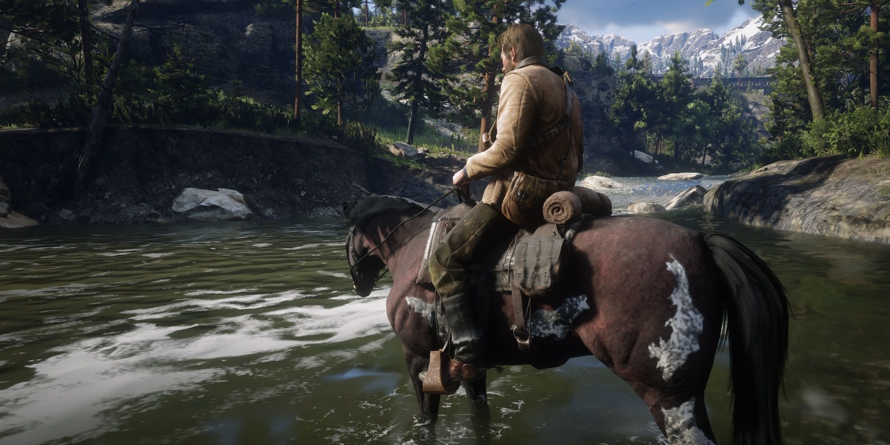 Arthur riding a horse near a river stream