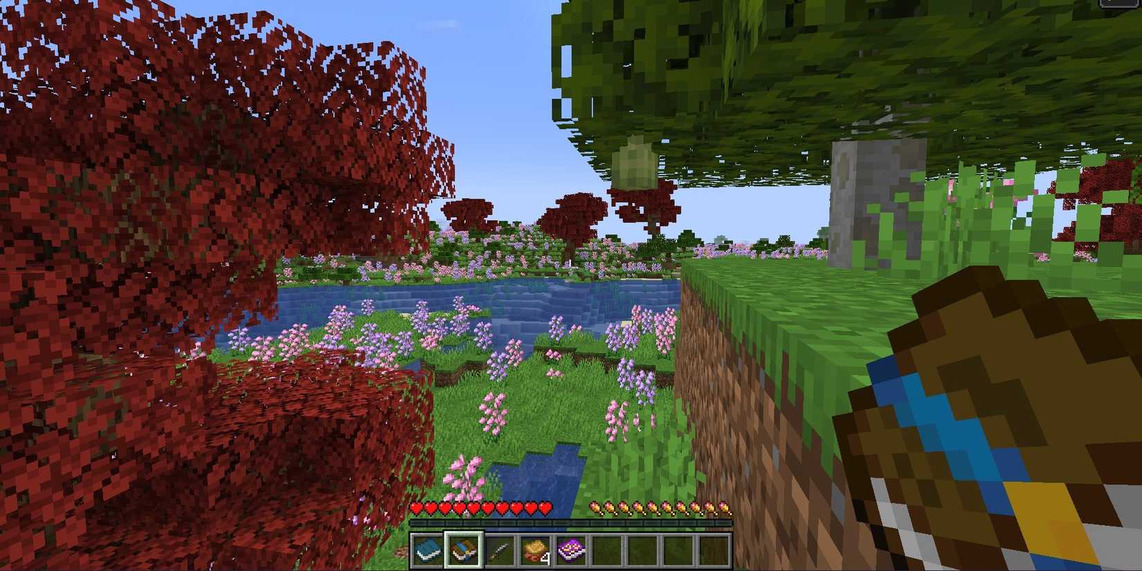 flowers grass tree and book with fruit