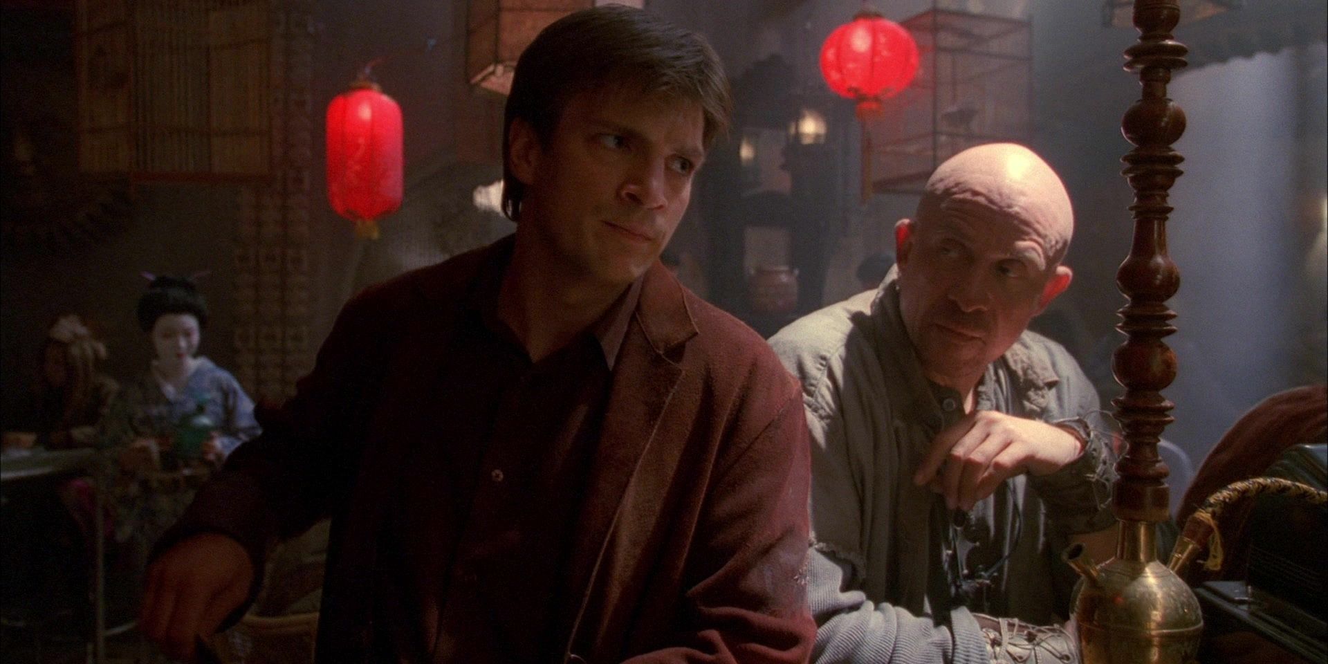 Firefly scene with Malcolm leaning on a bar and a bald man next to him