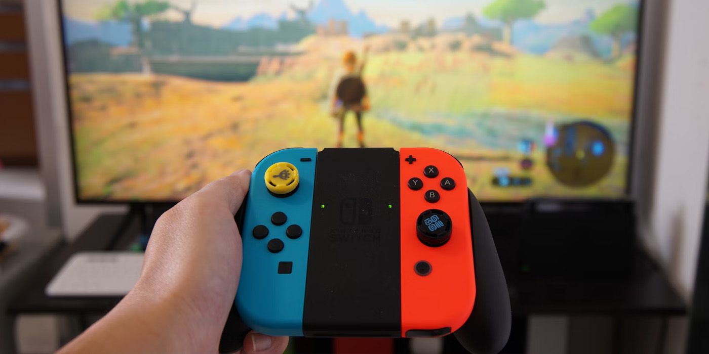 Nintendo Switch in Hand Playing BOTW - Ke Vin