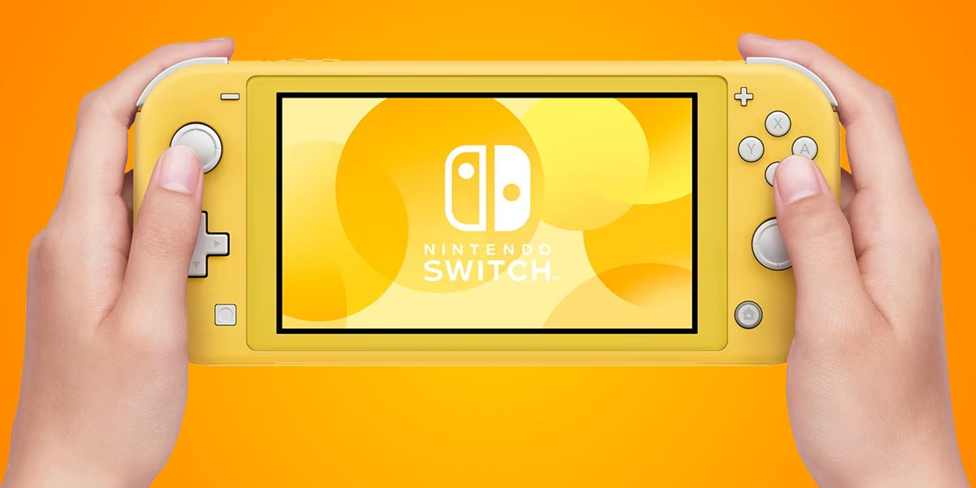 Nintendo Switch Lite in hand - Yellow