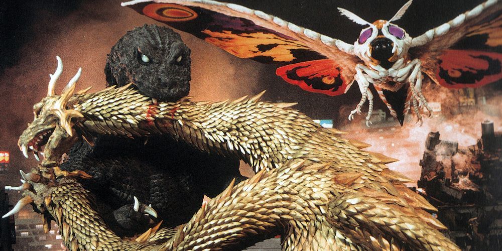 Promotional photo of Ghost Godzilla fighting Ghidorah and Mothra.