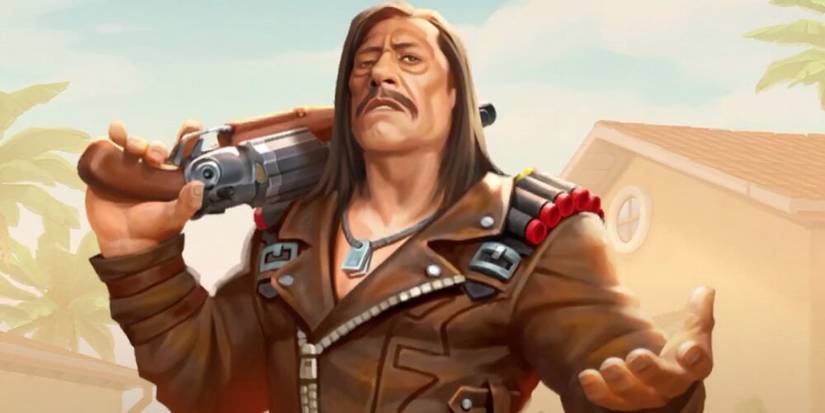 Danny Trejo with long hair holding a sawed off shotgun over his shoulder 