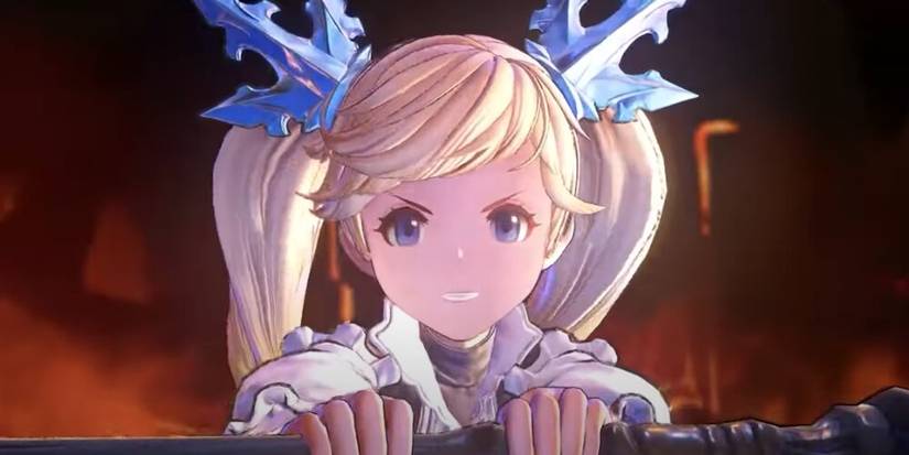 Io holding out her staff with an evil smile on her face 