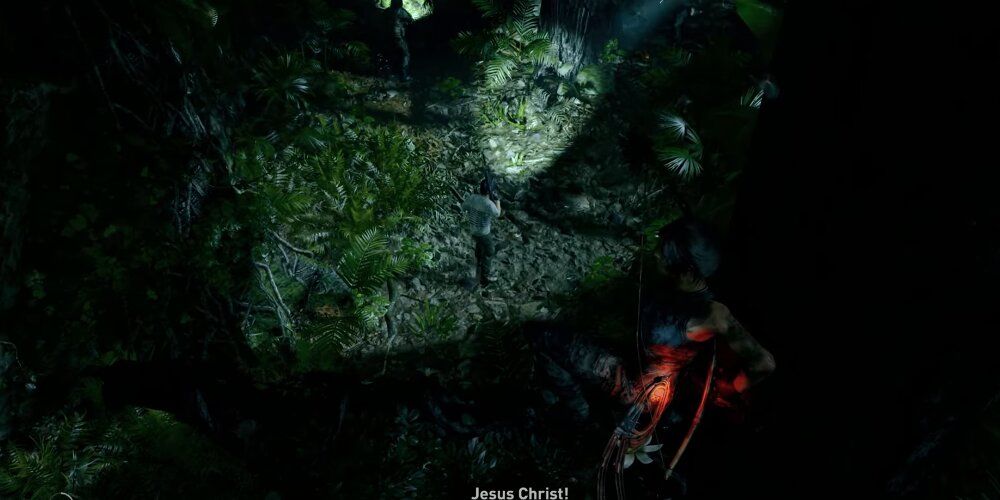 Lara hiding in the shadows while an enemy is in front of her 