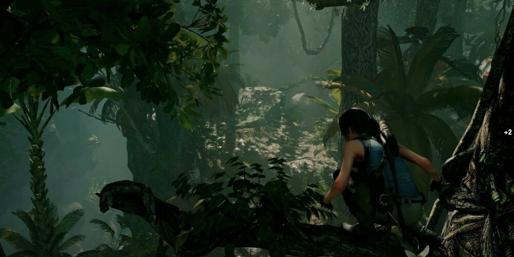 Lara on a tree branch in a jungle 