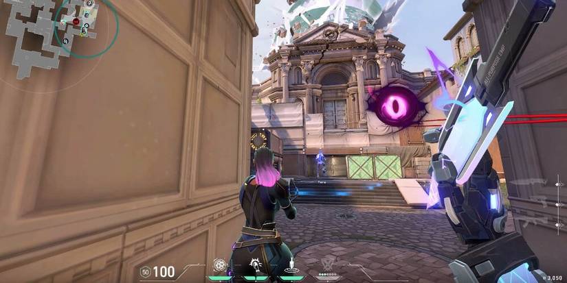 Player holding a knife with a large temple in the background 